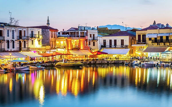Old Venetian harbour, taverns on seaside at dusk, Rethymno (Rethymnon), Crete, Greek Islands