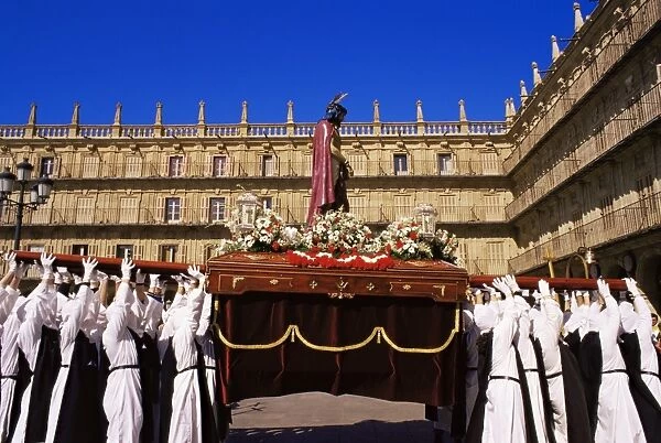 Penitents lifting the Jesus Christ carriage during Semana Santa