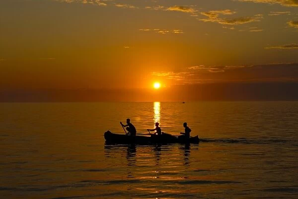 People rowing home at sunset at Ifaty, near Toliara, Madagascar, Indian Ocean, Africa