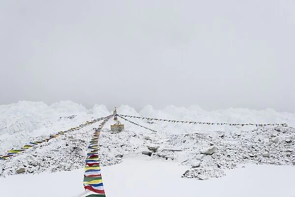 A puja adorned with prayer flags on the Khumbu glacier at Everest Base Camp, Khumbu Region