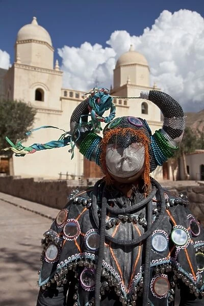 Reveller in costume and mask at Humahuaca carnival in Jujuy province in the Andes