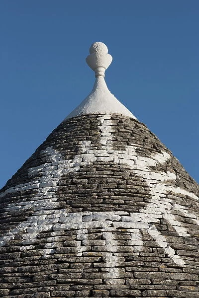 Sun painted on roof of traditional trullo in Alberobello, UNESCO World Heritage Site, Puglia, Italy, Europe