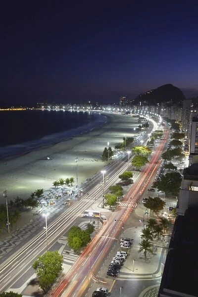 View of Copacabana beach and Avenida Atlantica at dusk, Copacabana, Rio de Janeiro, Brazil, South America