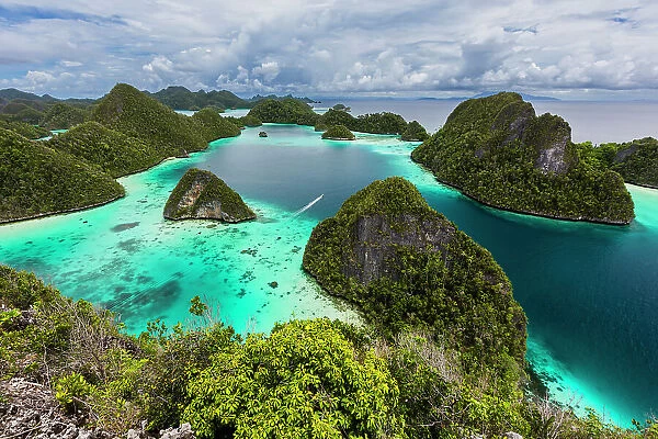 A view from on top of the small islets of the natural protected harbor in Wayag Bay, Raja Ampat, Indonesia, Southeast Asia, Asia