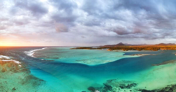 Aerial panoramic of turquoise lagoon and Ile aux Cerfs island, Trou d Eau Douce