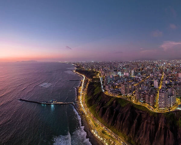 Aerial view over Miraflores at dusk, Lima, Peru, South America