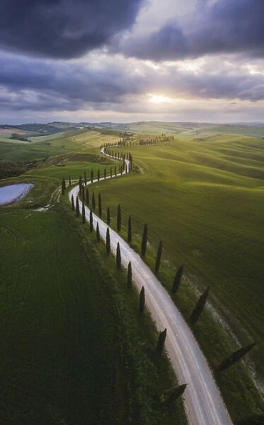 Agriturismo Baccoleno and its cypress road during a spring, Crete Senesi, Tuscany, Italy