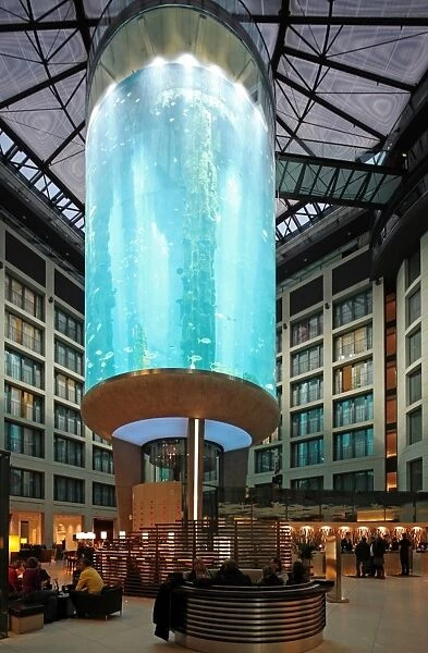 Atrium of the DomAquar e Hotel with a massive aquarium in the middle. Berlin, Germany