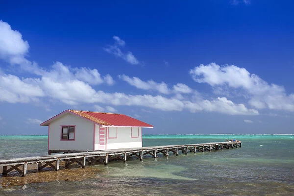 Central America, Belize, Ambergris Caye, San Pedro, a red hut on a jetty contrasted