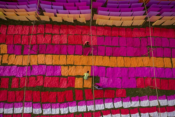 Drying multicolor cloth under sunlight, Narayanganj, Bangladesh
