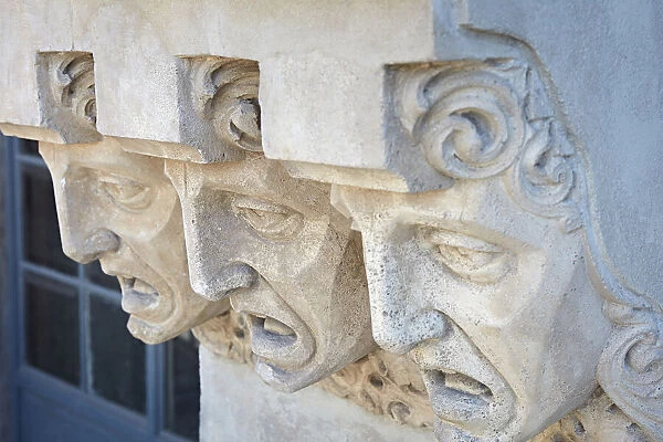 Detail of faces carved on the exterior facade of the historic '