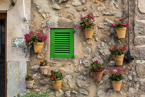 Flower pots on wall, Valldemossa, Serra de Tramuntana, Mallorca, Balearic Islands, Spain