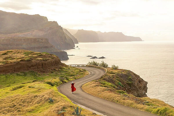 a girl enjoys the beautiful spring sunset, Miraoduro de Sao Lourenco, Madeira, Portugal (MR)