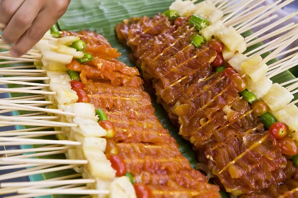 Kebabs, skewered meat for barbecue on street stall, Bangkok, Thailand