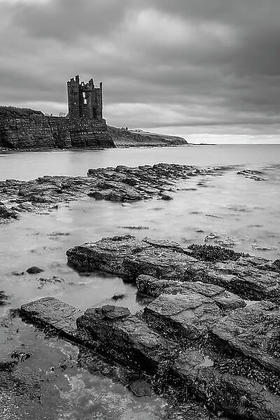 Keiss Castle perched precariously on the cliffs overlooking Sinclair's Bay, Caithness, Scotland. Autumn (September) 2022