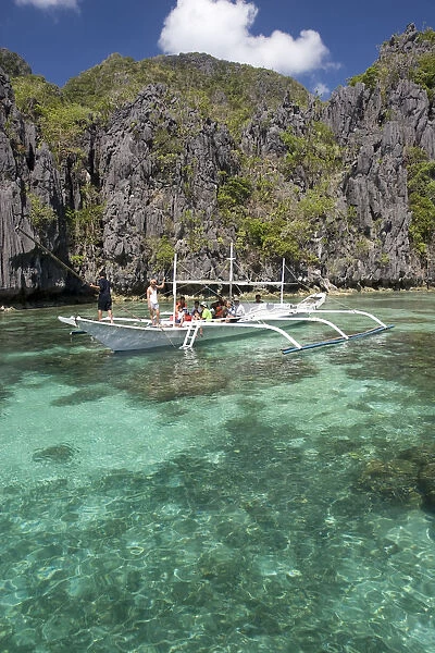 Outrigger boat in lagoon, El Nido, Palawan Island, The Philippines