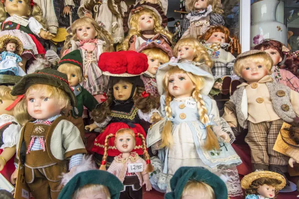 Porcelain dolls on display in a shop window, Rothenburg ob der Tauber, Bavaria, Germany