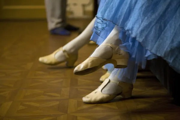 St. Petersburg, Russia; Detail of ballerinas shoes and dress during a short rest backstage during the perfromance of Tchaikovskys ballet