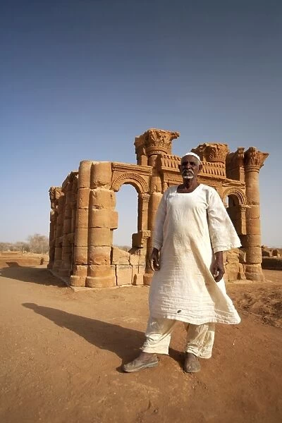 Sudan, Nagaa. The solitary guide at the remote ruins of Nagaa stands in front of the ruins