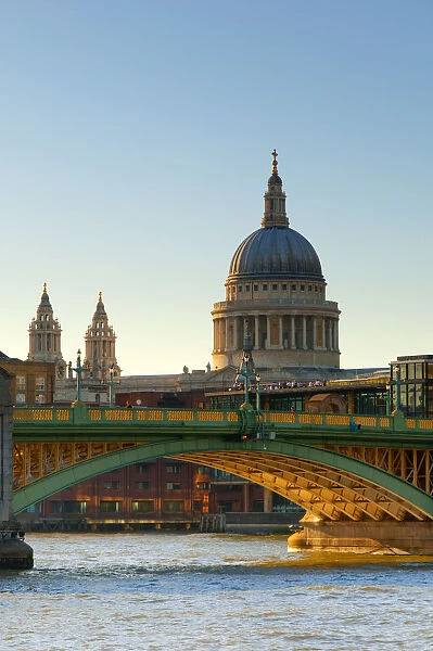 UK, London, St. Pauls Cathedral and Canon Street Railway Bridge across River