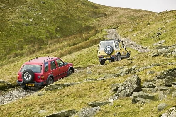 Off road vehicles on the Walna Scar road above Coniston in the Lake District UK