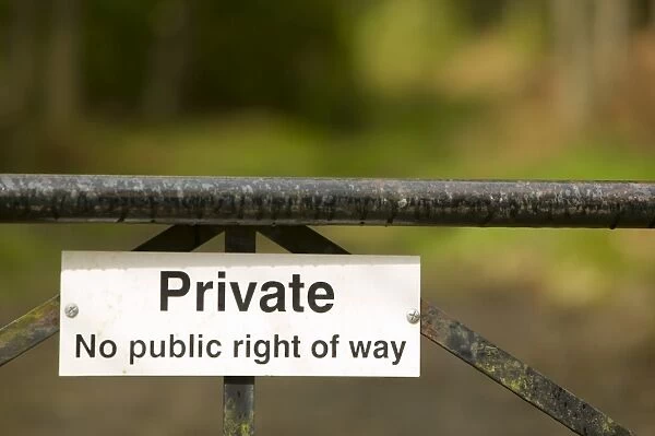 A private sign on a gate