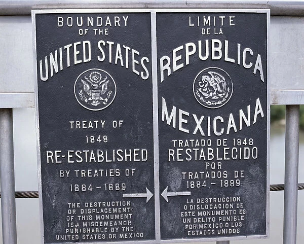 10019536. USA Texas Laredo Bilingual boundary sign on International Bridge between Mexico