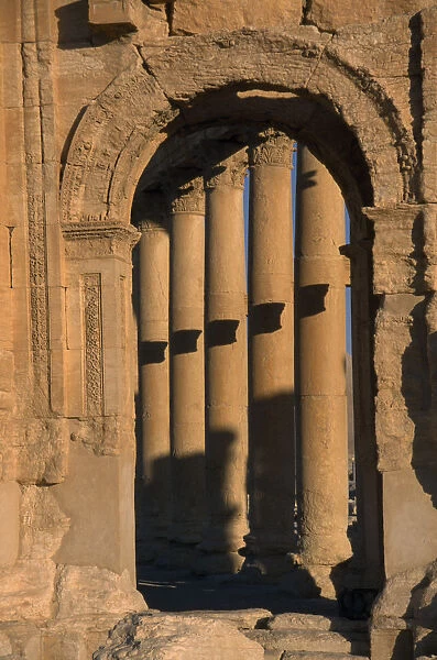 20014356. SYRIA Central Tadmur Monumental arch framing detail of colonnaded street Palmyra
