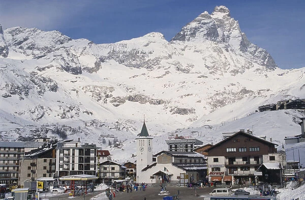 20026875. ITALY Valle d Aosta Breuil Cervinia Ski resort town with church hotel
