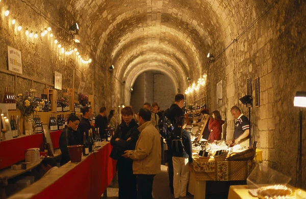20038007. FRANCE Loire Valley Amboise Indoor Wine Festival with people tasting at stalls