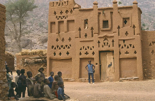 20040117. MALI Architecture Dogon village Elders house with man standing outside