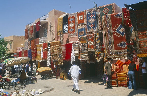 20067630. MOROCCO Marrakesh The souk with carpets displayed