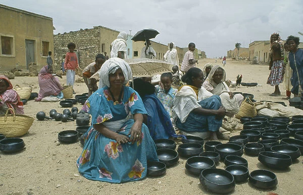 20070812. ERITREA Decamare Women selling black pottery at market