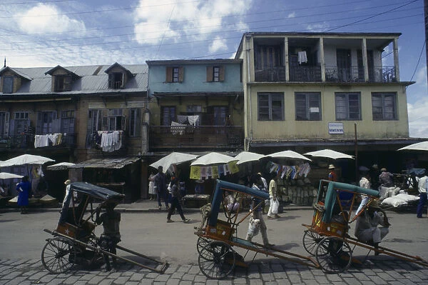 20076084. MADAGASCAR Antananarivo Street scene with washing hanging