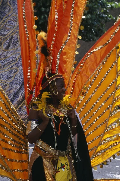 20079504. ENGLAND London Notting Hill carnival woman in extravagant costume. Nottinghill