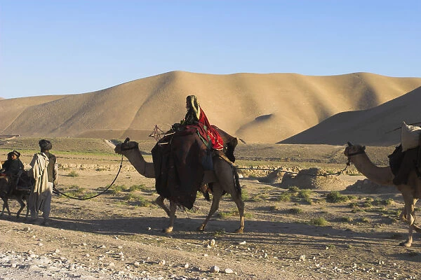 20085058. AFGHANISTAN Desert Kuchie camel train between Maimana and Mazar-I-Sharif