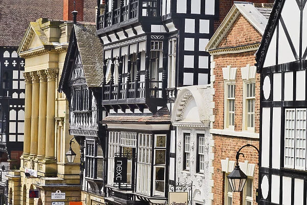 England, Cheshire, Chester, Row of buildings with a mix of architectural styles on Eastgate Street