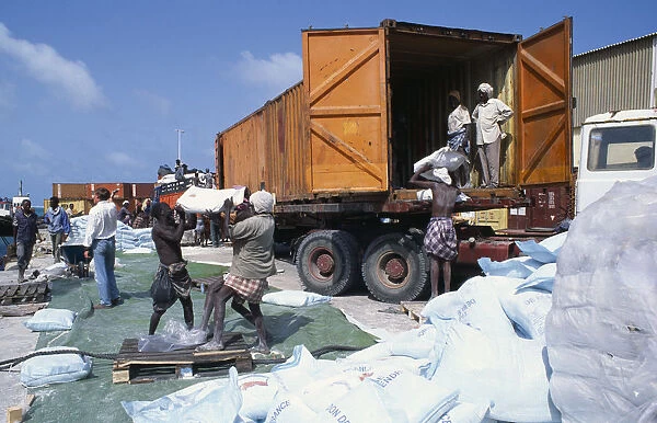 SOMALIA, Mogadishu Loading French food aid of wheat flour onto truck for distribution
