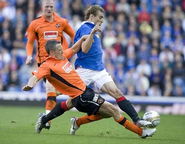 Intense Clash at Ibrox: Jelavic vs. Severin - Rangers 4-0 Victory over Dundee United
