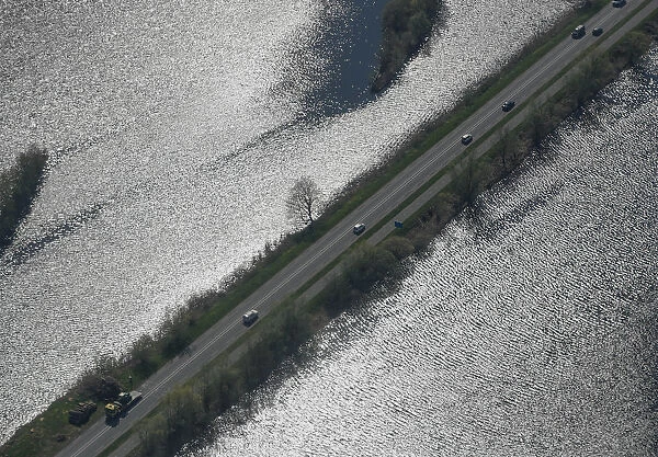 Aerial view of a road surrounded by water near Amsterdam