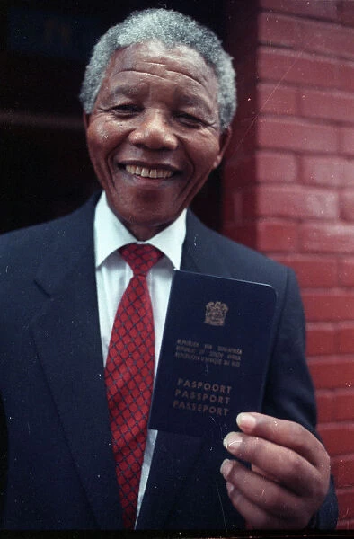 Black nationalist leader Nelson Mandela shows his passport