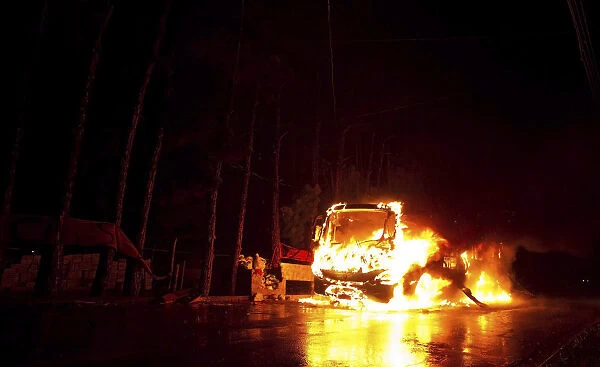 Bus is seen on fire in front of Pinheirinho slum where residents try to fight eviction