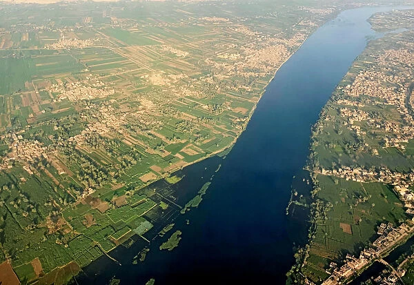 A general view of The Nile River, houses and agricultural land from the window of an