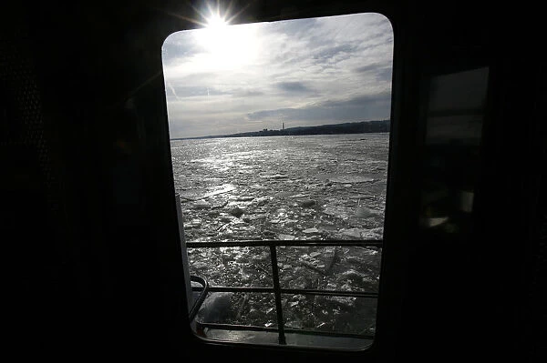 Ice is seen on the Hudson River through a window of the U. S