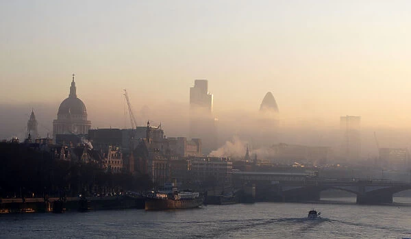Londons skyline is seen beyond the river Thames from Waterloo Bridge