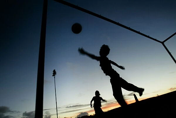 NATIVES RAPA NUI BOYS PLAY FOOTBALL ON EASTER ISLAND