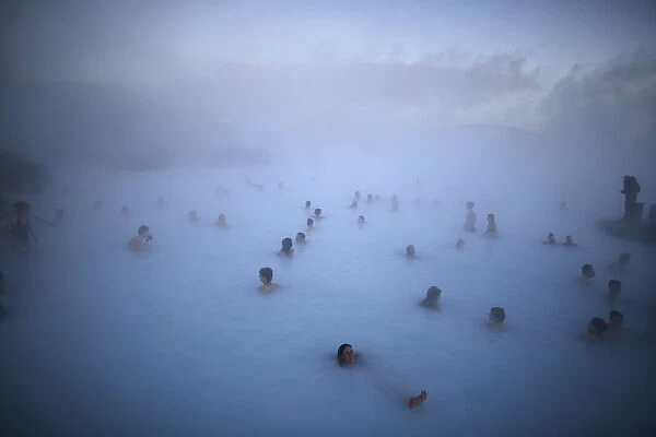 People relax in one of the Blue Lagoon hot springs near the town of Grindavik