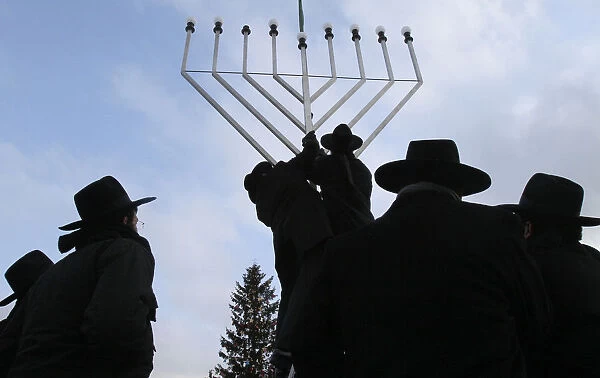 Rabbis inspect the setting-up of a large Menorah in front of the Brandenburg Gate in