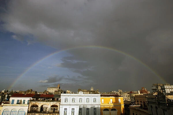 A rainbow appears over Old Havana as rains from the outer bands of Hurricane Dean