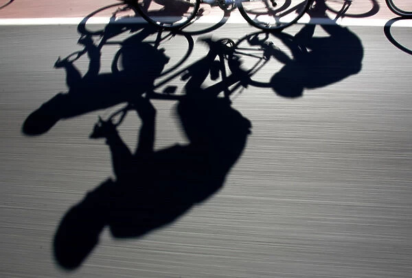 Riders cast shadows as they cycle during the third stage of the Mallorca Challenge